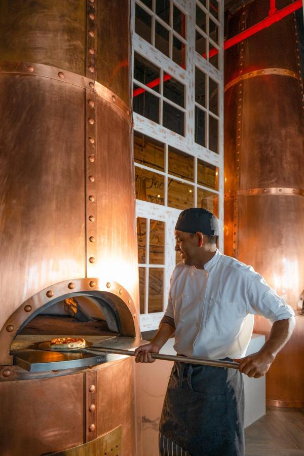 Nickelodeon Hotels & Resorts Riviera Maya Puerto Morelos Exterior foto A distillery worker checking the temperature of the mash